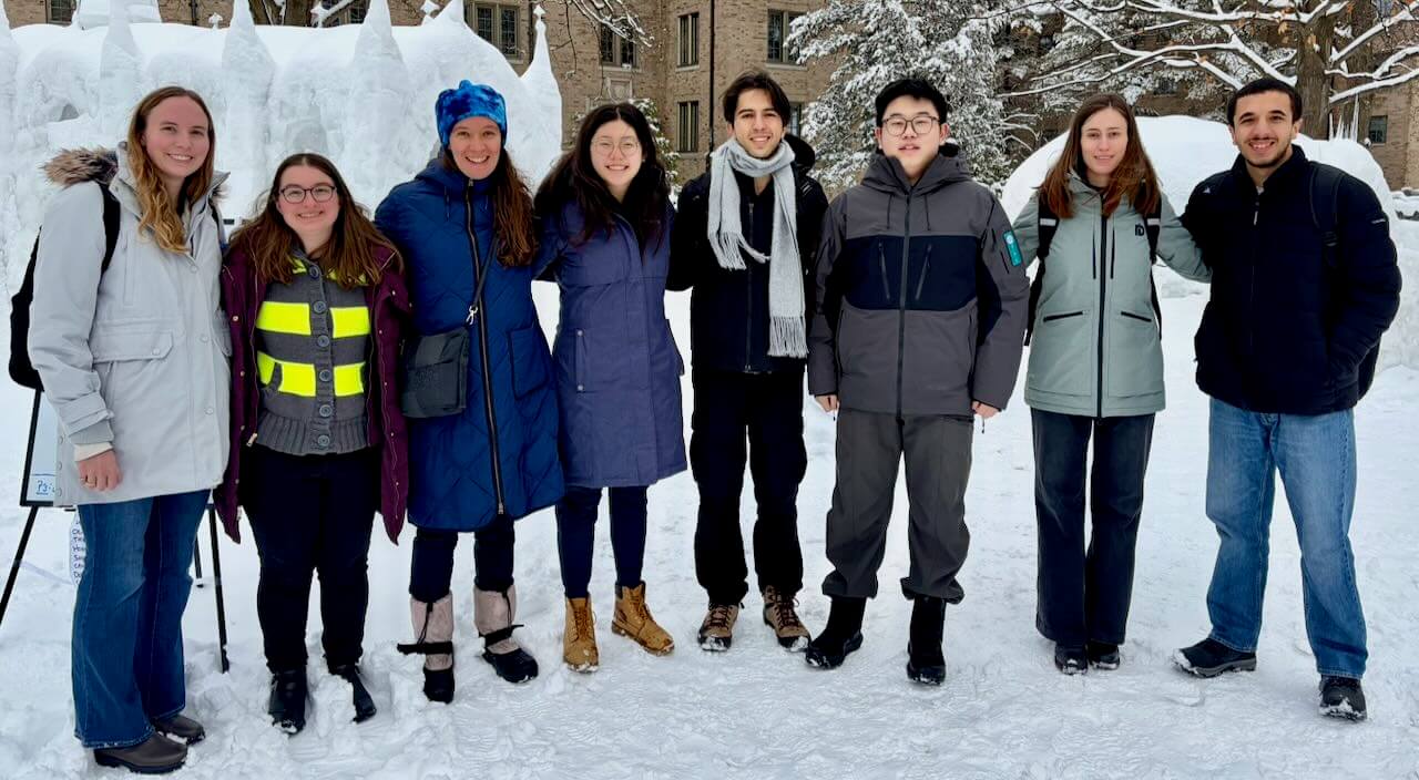 Cropped version of photo of lab members in front of Notre Dame's ice chapel in Spring 2026